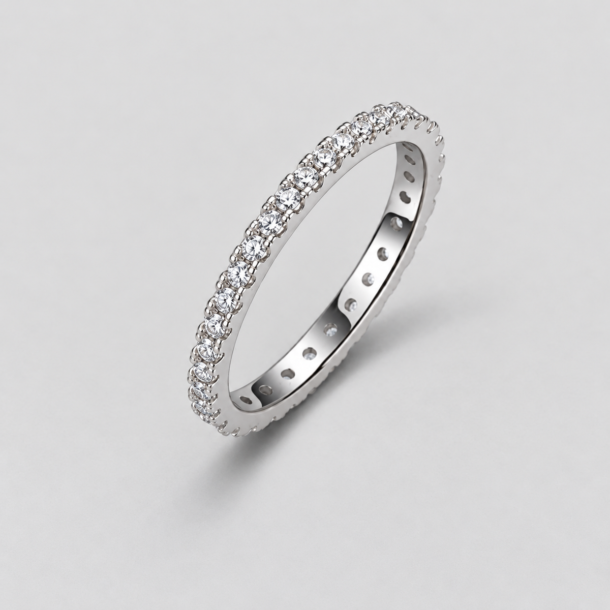Round Moissanite Eternity Band in 925 sterling silver.