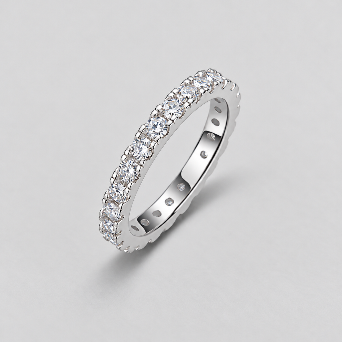 Round Moissanite Eternity Band in 925 sterling silver.