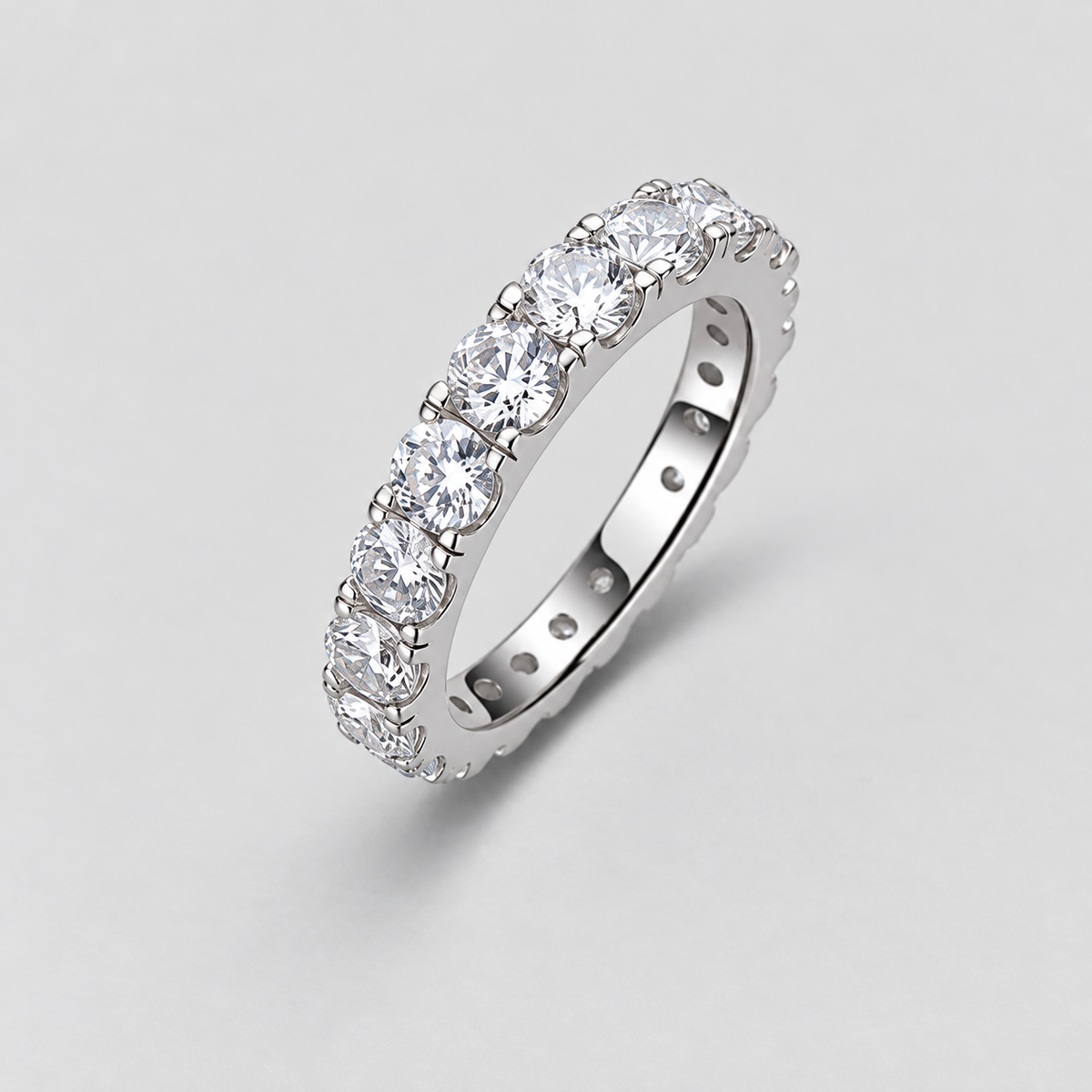 Round Moissanite Eternity Band in 925 sterling silver.
