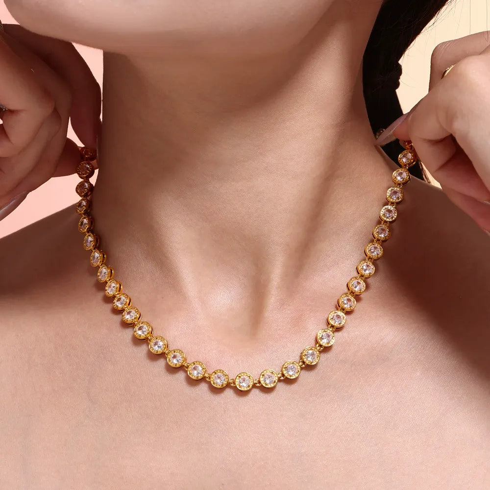Clear round stone tennis necklace worn on the neck