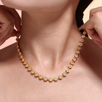 Clear round stone tennis necklace worn on the neck