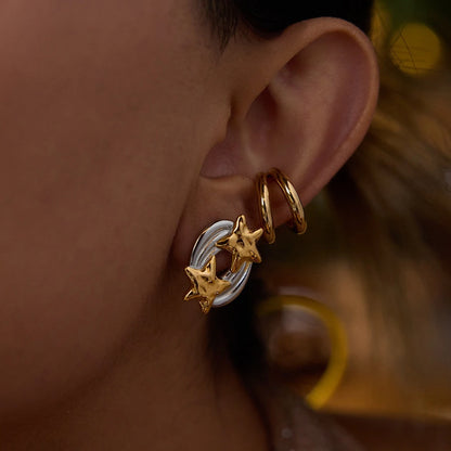 Double star earrings styled with a double hoop ear cuff