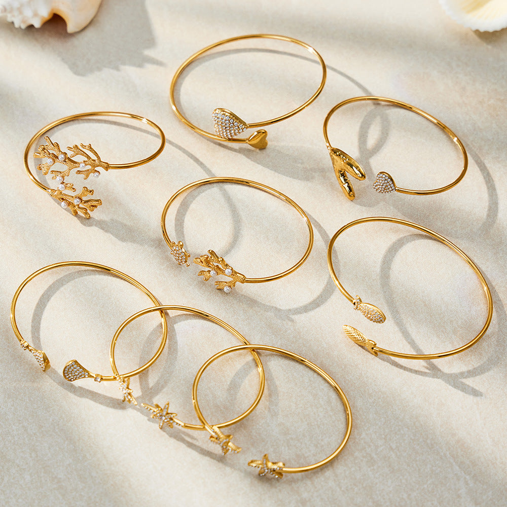 Ocean Motif Zircon Open Bangle — flat lay 04