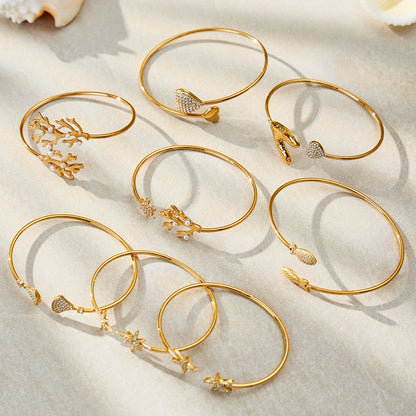 Ocean Motif Zircon Open Bangle — flat lay 04