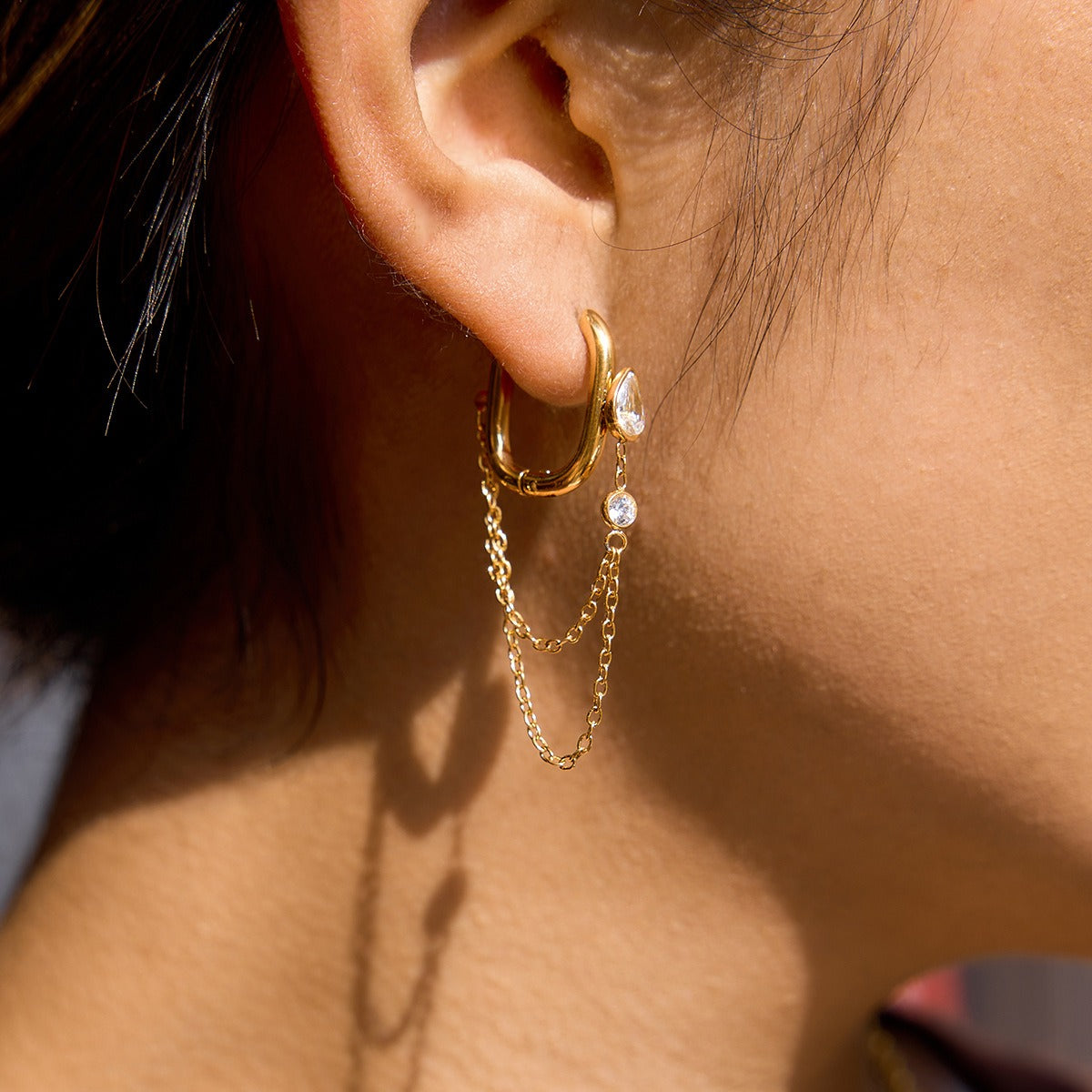 Gold-Tone Teardrop Zircon Chain Earrings — styled view 03