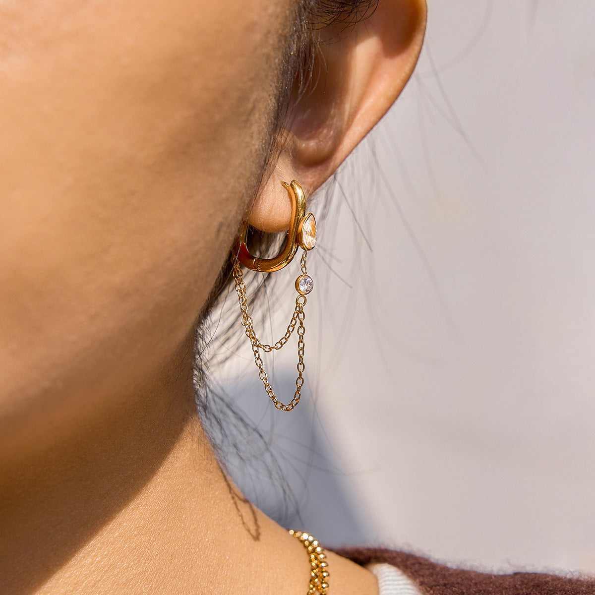 Gold-Tone Teardrop Zircon Chain Earrings — styled view 04