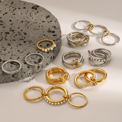 Assorted Stacking Pearl and Zircon Rings — flat lay 04