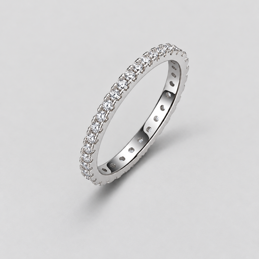 Round Moissanite Eternity Band in 925 sterling silver.
