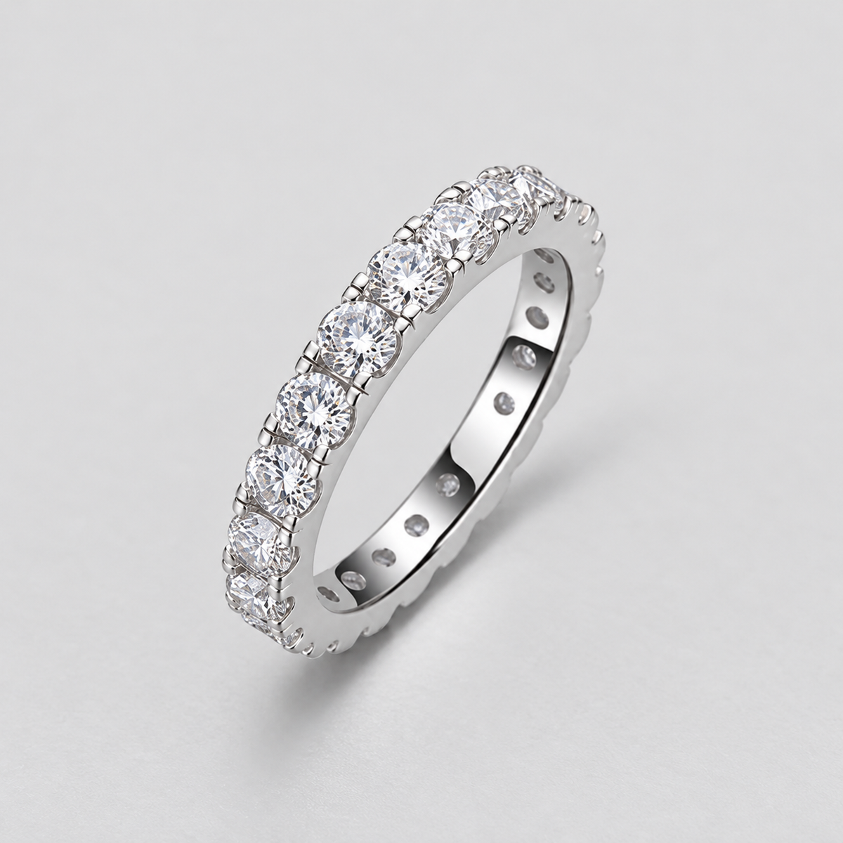 Round Moissanite Eternity Band in 925 sterling silver.