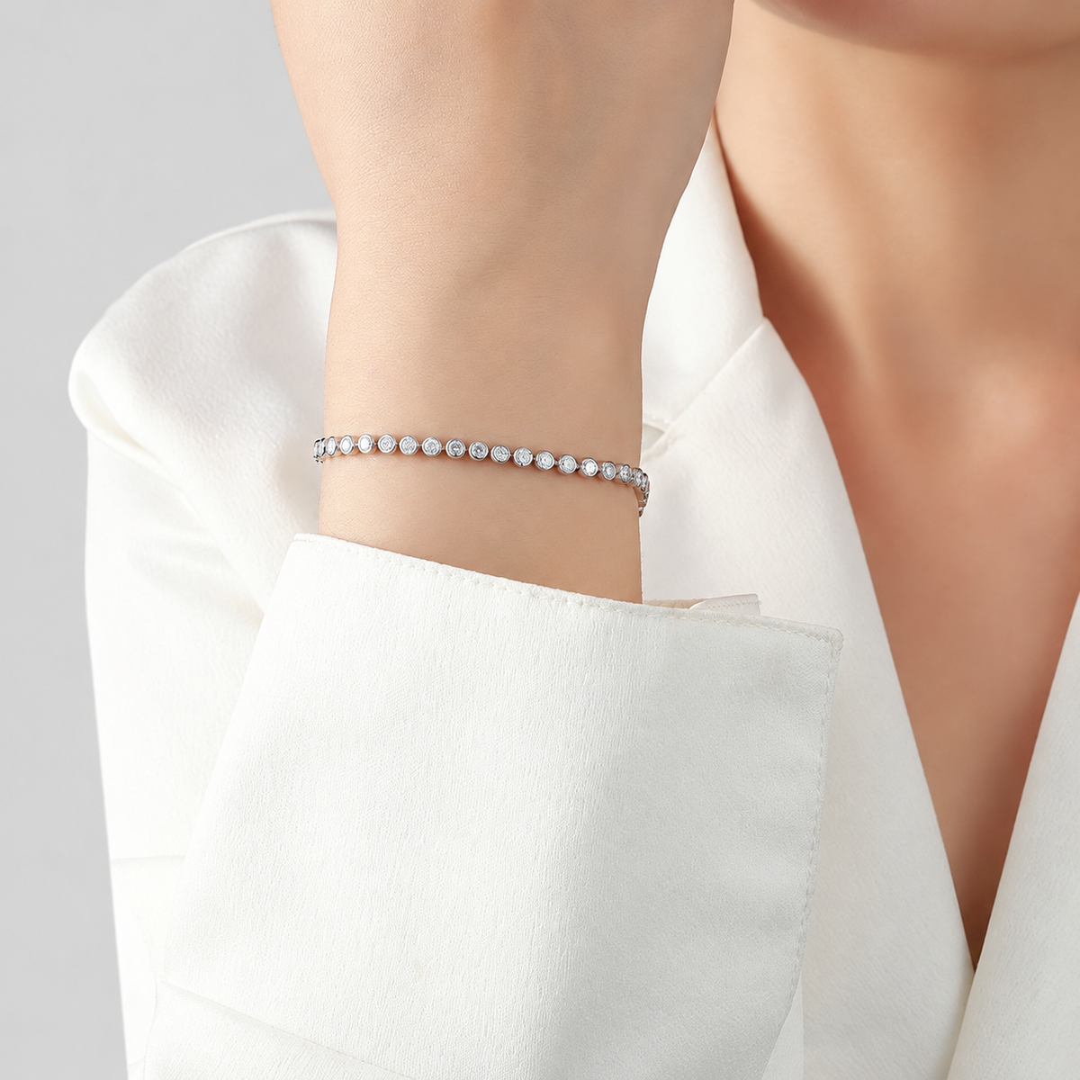 Bezel-Set Moissanite Tennis Bracelet in 925 sterling silver, silver finish.