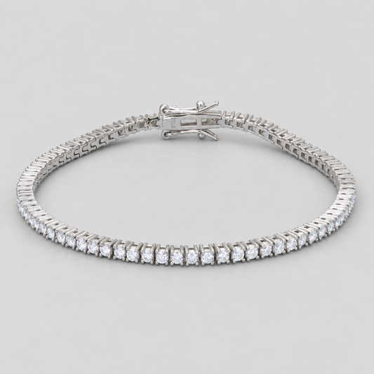 Silver-finish moissanite tennis bracelet on a natural light gray background.