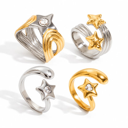 Four star motif open ring designs with clear stone details on a white background